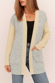 Straight front view of the light-gray and pastel-yellow colorblock open-front cardigan with ribbed placket and patch pockets.