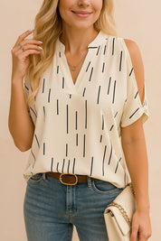 Front view of the multicolor cold-shoulder blouse showing the notched neckline and loose short sleeves; lightweight woven texture with a soft front tuck.