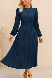 Navy-blue pleated long-sleeve midi dress with slim keyhole neckline and matching waist belt — front view