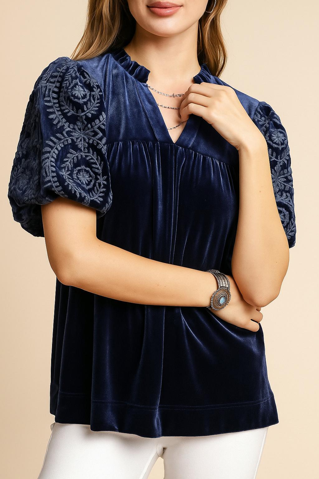 Women’s navy velvet blouse with embroidered puff sleeves and soft notched V neckline — front detail view