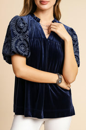 Women’s navy velvet blouse with embroidered puff sleeves and soft notched V neckline — front detail view