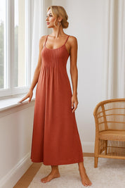 Sleeveless terracotta nightgown with thin straps and pleated front — soft fabric, full-length comfort