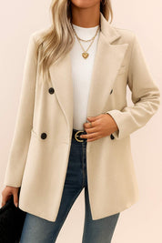 Front view of the oatmeal beige herringbone double-breasted coat with notched lapel, open front stance, long sleeves and welt pockets.