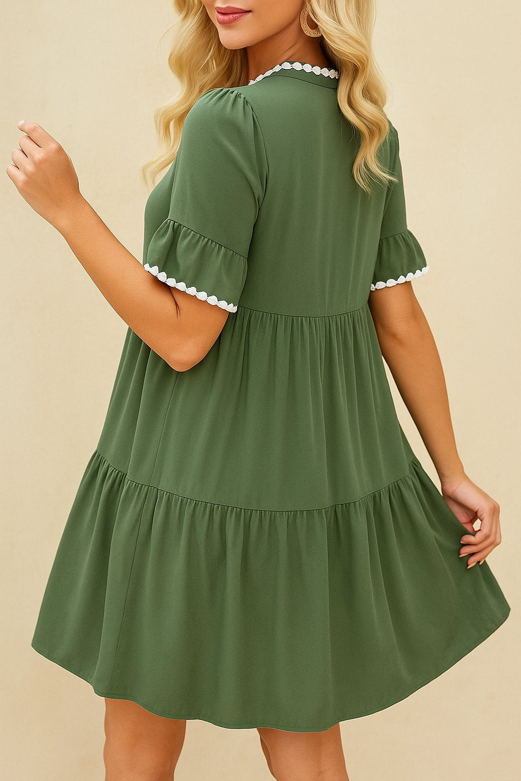 Olive green tiered mini dress with white lace trim and flounce sleeves — back view