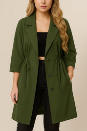 Centered front view of the olive green plus-size lapel trench coat with roll-tab sleeves, drawstring waist and button-down front.