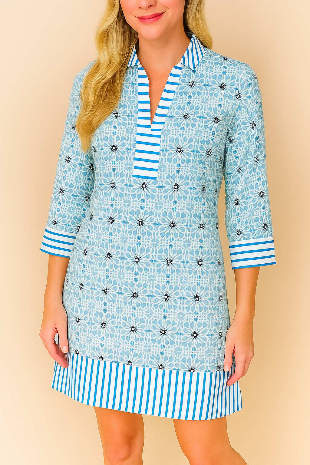 Pastel-blue floral tunic dress with striped collar, cuffs and hem, easy pullover design — mid-length front view