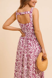Pink-floral sleeveless maxi dress with square back cutout and gathered waist — back view.
