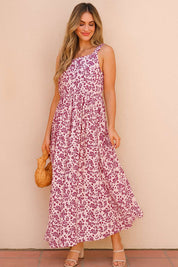 Pink-floral square-neck sleeveless maxi dress styled for summer with airy A-line sway — outdoor front three-quarter view.