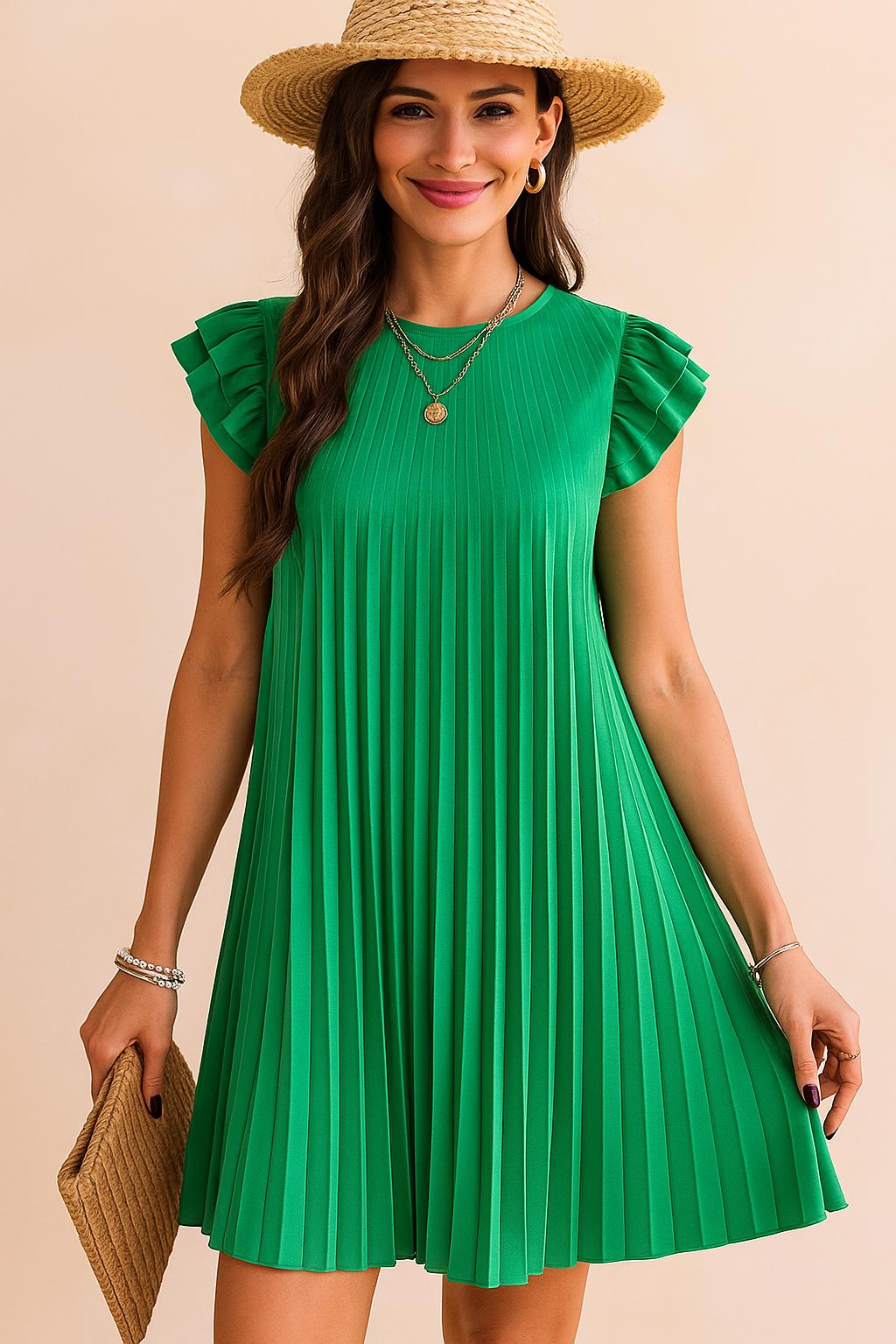 Front view of a woman wearing a pleated green mini dress with ruffle sleeves, straw hat, gold layered necklaces and a woven clutch — perfect sunny day outfit.