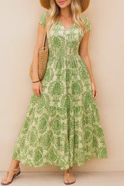 Boho-print V-neck cap-sleeve maxi dress with smocked bodice and flowing skirt, shown in purple, green and dark-blue colorways — studio lookbook video.