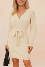 Short lookbook video showcasing a women’s ribbed-knit wrap sweater dress with a cross-over V-neck, long sleeves and a self-tie waist, shown from front and back in clean studio lighting.