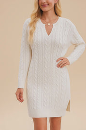 Short lookbook video showcasing a women’s cable-knit sweater dress with V-notch neckline, long sleeves, ribbed hem and a subtle side slit, presented in clean studio lighting.
