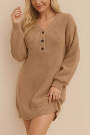 Short lookbook video showcasing a women’s waffle-knit henley sweater dress with a V-neck and three-button placket, long balloon sleeves, ribbed cuffs and hem, and an above-knee relaxed fit in clean studio lighting.