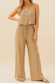 Short studio lookbook video of a camel two-piece set with a button-front V-neck tank and wide-leg drawstring pants shown on-body.