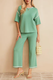 Short studio lookbook video of the Gum Leaf contrast-trim lounge set with elbow-sleeve top and wide-leg pants.