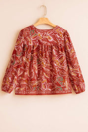 Hanger flatlay, back view of the red-multi paisley blouse with a gathered back yoke and border print along the hem