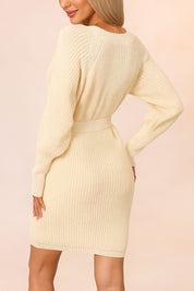 Back view of the ribbed-knit wrap sweater dress showing the cinched tie belt, long sleeves and a clean ribbed hem for a body-skimming silhouette.