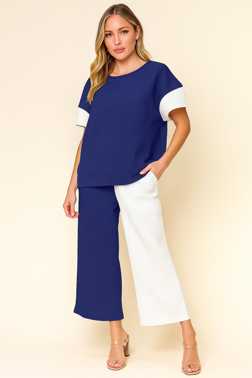 Centered front view of the royal-blue and white colorblock textured top with matching wide-leg pants