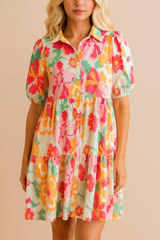 Floral button-down babydoll dress in strawberry multi with shirt collar, puff sleeves and tiered mini skirt — front view
