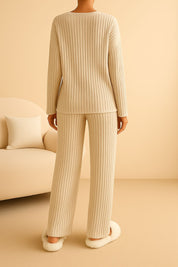 an ribbed knit lounge set with clean back and vertical rib texture, straight-leg pants — back view (sofa scene).