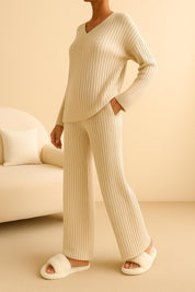 Tan ribbed knit V-neck lounge set with long sleeves and straight-leg pants, lightweight year-round knit — left three-quarter view.