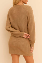 Back view of the women’s waffle-knit henley sweater dress showing the cozy texture, dropped shoulders, long sleeves and ribbed hem that skims above the knee for a relaxed silhouette.