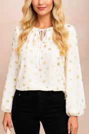 Women’s white tie-neck blouse with gathered neckline and gold-foil dots, long sleeves with elastic cuffs — centered front view