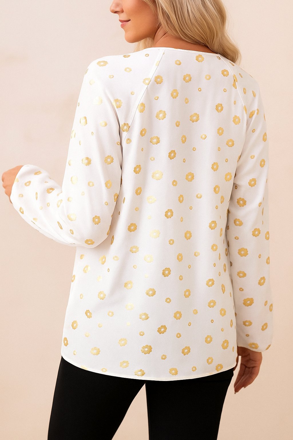 White tie-neck blouse with gold-foil dot print, relaxed fit and curved hem — back view.