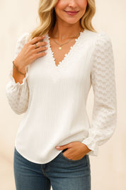 White lace-trim V-neck blouse with vertical ribbed body and puffed sheer sleeves with elastic cuffs — centered front view