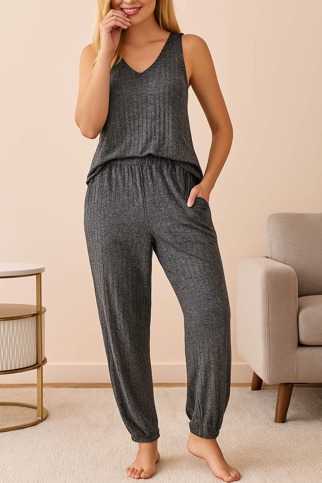 Women's dark grey knit loungewear pajama set with sleeveless top and jogger-style pants, comfortable homewear outfit