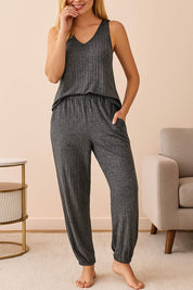 Women's dark grey knit loungewear pajama set with sleeveless top and jogger-style pants, comfortable homewear outfit