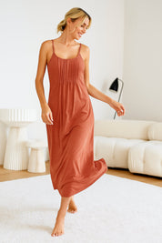 Smiling woman walking in soft terracotta sleeveless nightgown — breathable maxi loungewear for women at home