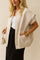 Front three-quarter view of an apricot textured snap-button bomber jacket with rib-knit collar, drop-shoulder long sleeves, patch pockets and an elastic hem.