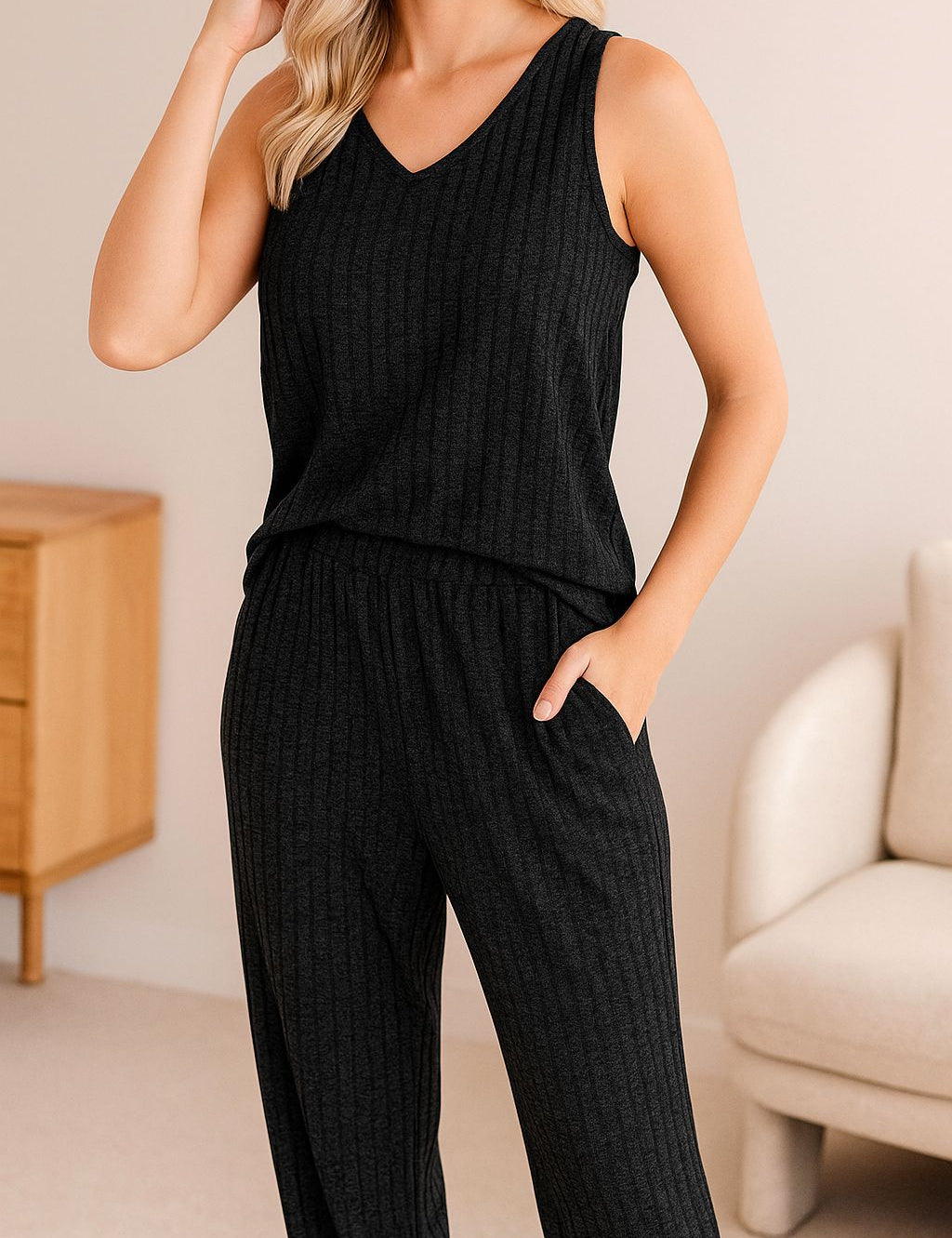 Women's black ribbed knit loungewear pajama set with sleeveless top and elastic waist pants