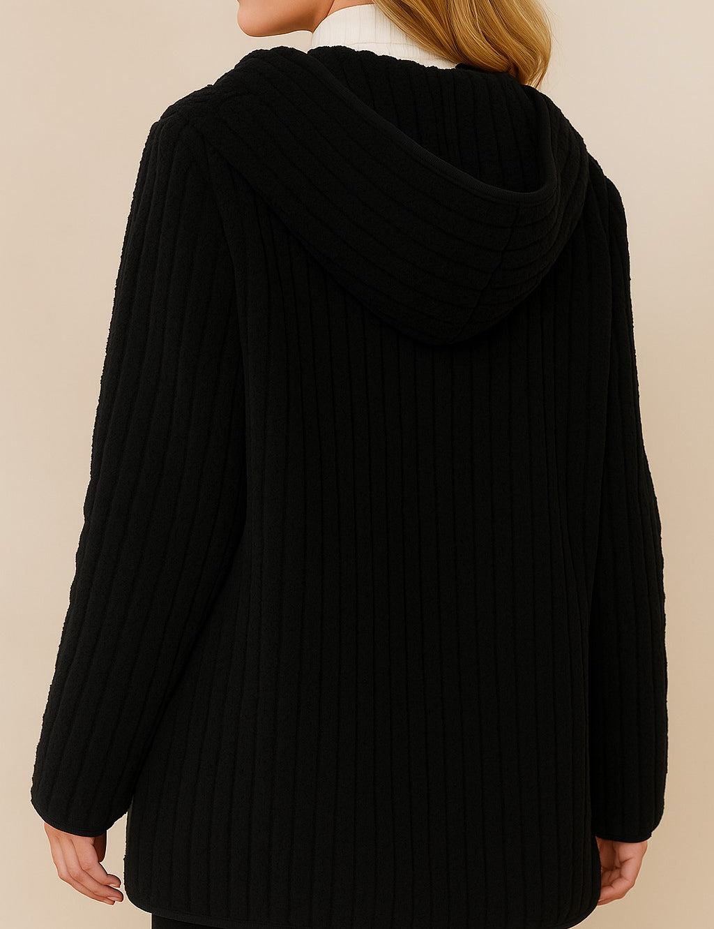 Back view of the black ribbed hooded coat with curved hem and full-coverage hood