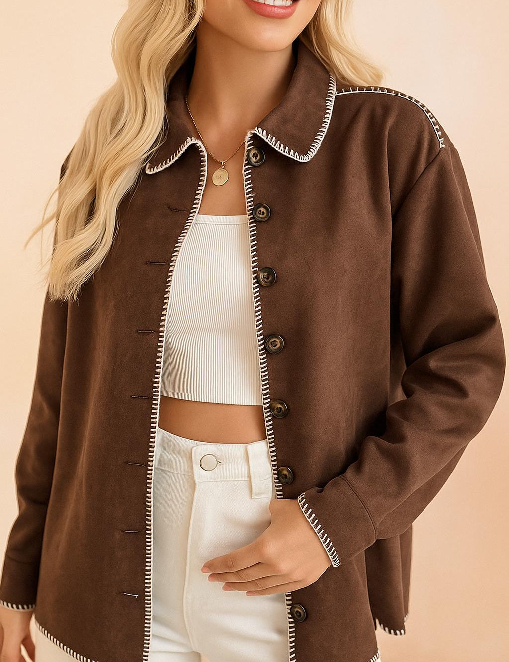 Front view of the brown faux-suede button-up shirt jacket worn open, showing the contrast whipstitch trim and long sleeves