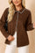 Front view of a women’s brown faux-suede button-up shirt jacket with contrast whipstitch trim along the collar, placket, cuffs and hem; long sleeves and a rounded straight hem.