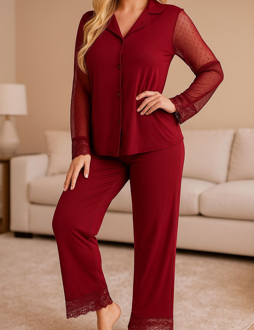 Woman in burgundy pajama set with full-length pants and sheer lace sleeves, elegant and comfortable nightwear
