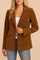 Front view of a women’s camel brown corduroy double-breasted blazer with a notched lapel, long sleeves and decorative flap pockets; straight hem