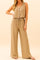 Front view of a women’s camel two-piece set pairing a button-front V-neck tank with wide-leg pants on an elastic drawstring waist; relaxed, above-ankle length