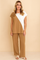Two‑piece set in camel with diagonal colorblock — round‑neck top and wide‑leg pants, elastic waist — front view.
