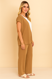 Left side view of the camel two-tone top and wide-leg pants set; smooth side profile and elastic-waist trousers visible.