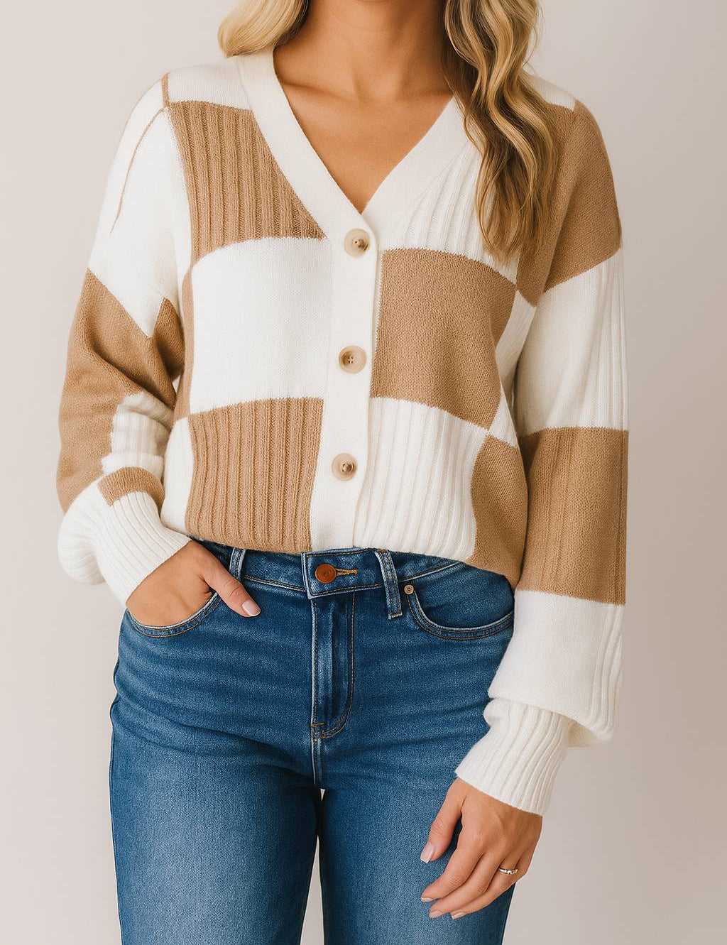 Front view of a women’s caramel and ivory colorblock knit V-neck button-up cardigan with drop-shoulder sleeves and ribbed cuffs and hem.