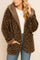 Front view of the chestnut leopard hooded coat with open front, long sleeves and rounded patch pockets.