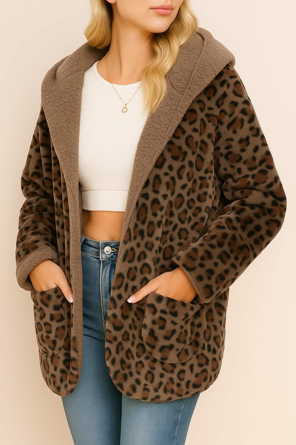 Left three-quarter view of a chestnut leopard hooded coat with open front, long sleeves and patch pockets.