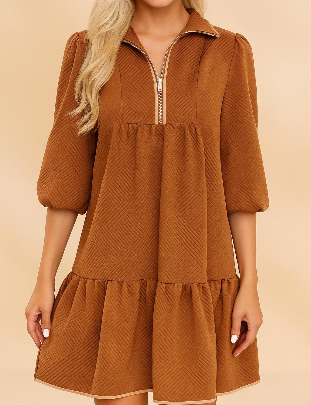 Front view of a women’s chevron-textured mini dress with a collared half-zip neckline, soft puff three-quarter sleeves and a drop-waist ruffle hem, creating a relaxed A-line swing silhouette.