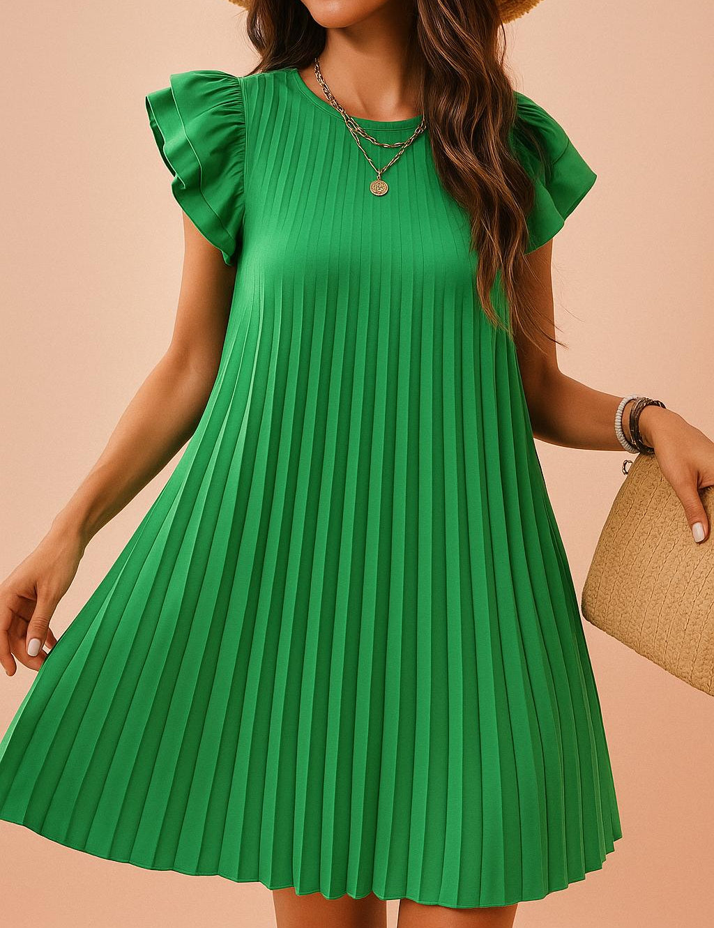 Close-up of pleated green dress with layered necklace and ruffle sleeve detail