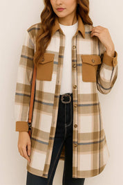 Centered front view of the coffee-brown and ivory plaid button-up coat with long sleeves, flap chest pockets and a straight rounded hem.