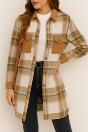 Front view of the coffee-brown and ivory plaid button-up longline coat with shirt collar, open placket, flap chest pockets and rounded hem.