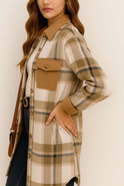 Left side view of the coffee-brown and ivory plaid longline coat with shirt collar, long sleeves and a visible slant pocket at the hip.